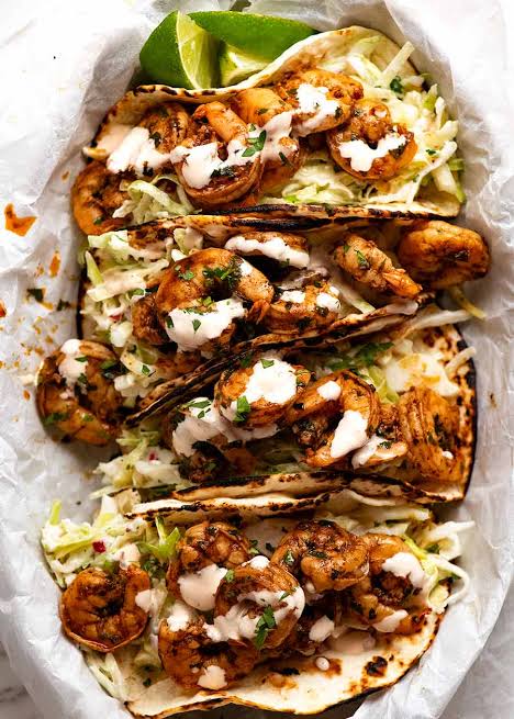 Shrimp tacos topped with fresh slaw and house sauce at Preva Kitchen Redford MI