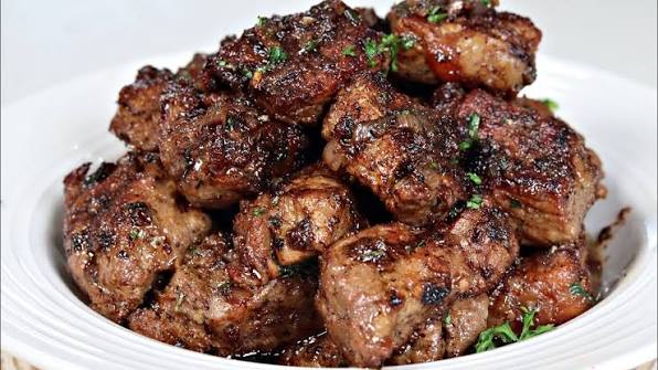 Grilled steak bites finished with garlic butter at Preva Kitchen Redford MI