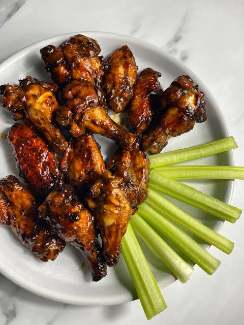 Caribbean jerk wings marinated in house spice and grilled at Preva Kitchen Redford MI